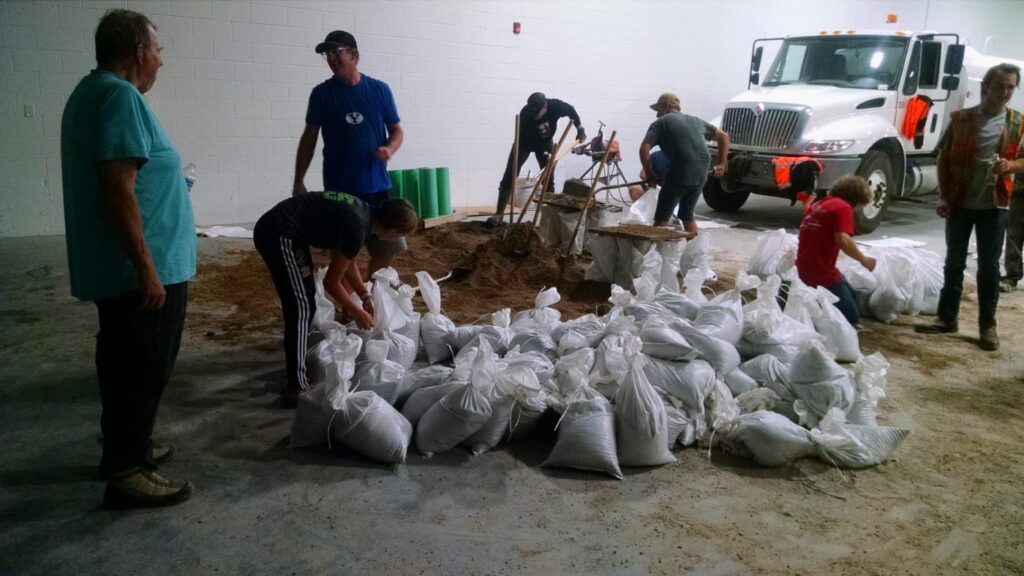 Volunteers filling sandbags after the 2021 Bountiful storm