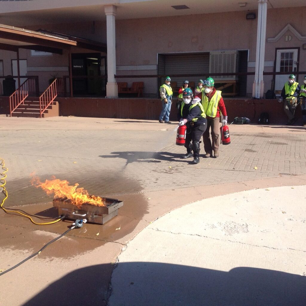 CERT volunteers practising fire suppression with extinguishers