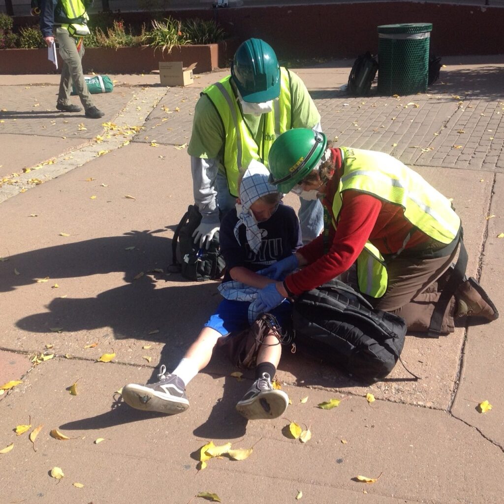 Two CERT volunteers treating an injured neighbour