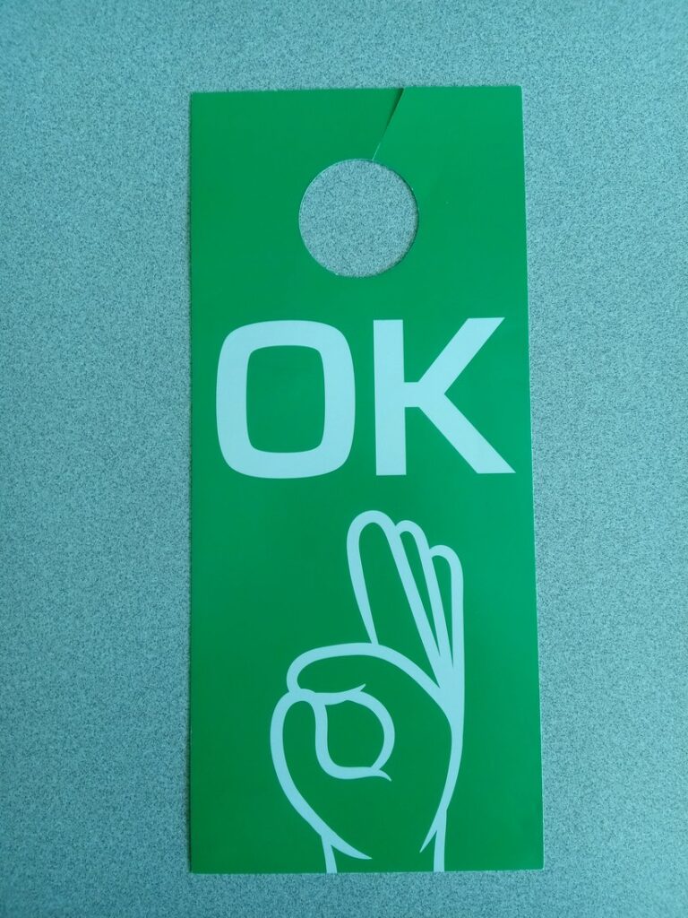 The green OK card a household displays when everyone inside is safe.
